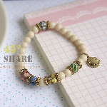 正韓民族風米白串珠鬆緊式特別手環飾品-B0410003J1